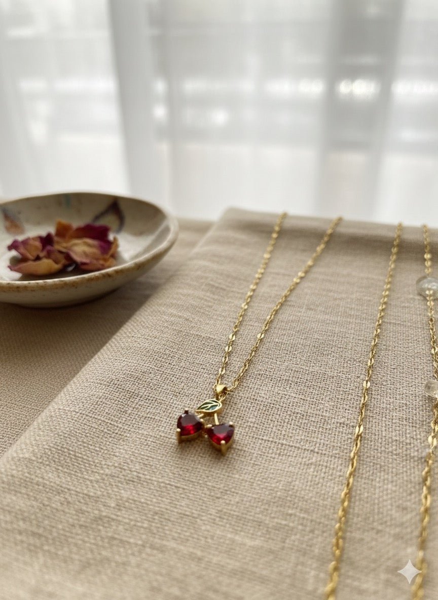Flat lay of Cherry charm necklace - CharmsCrafted