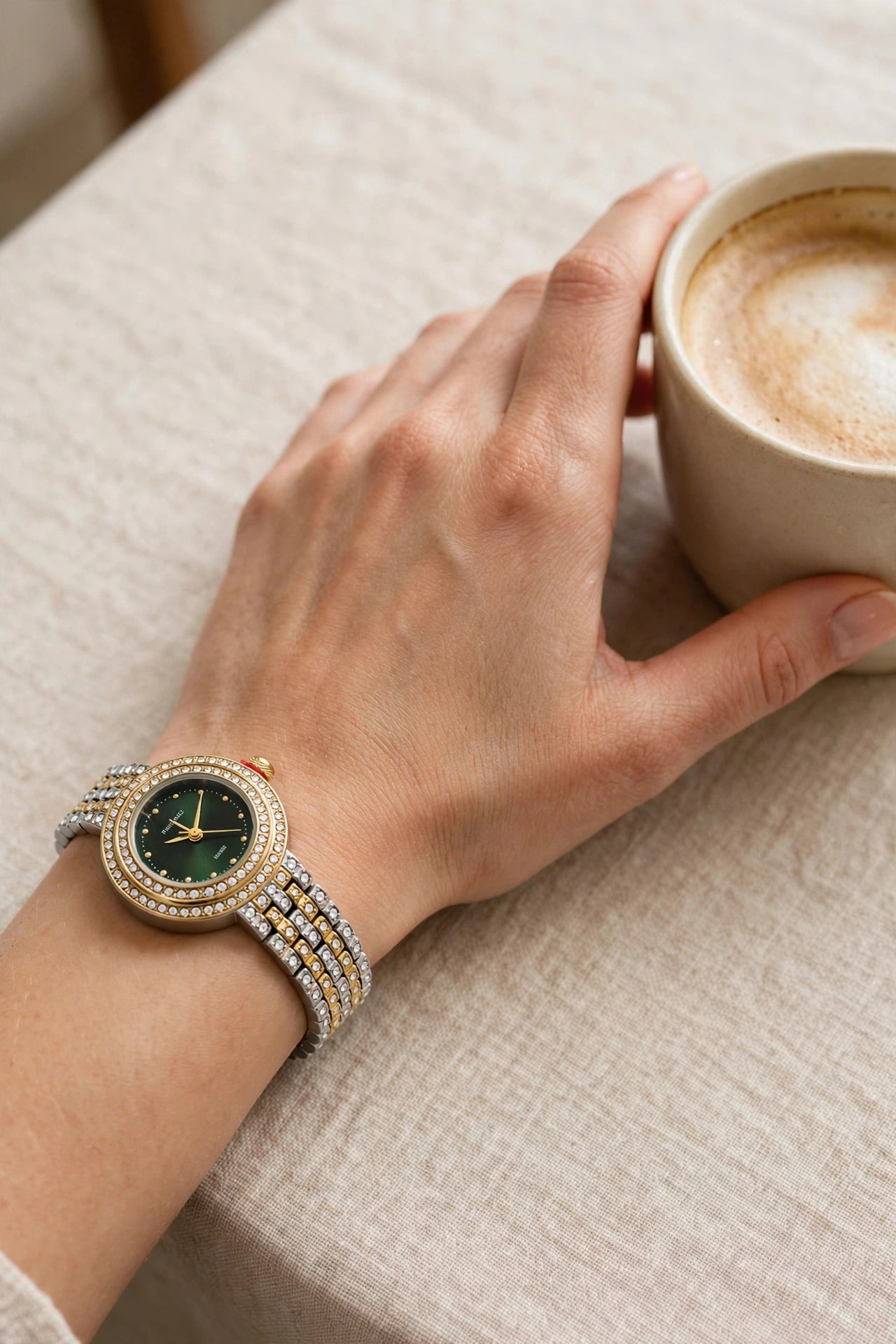 Woman wearing Emerald Aura — Two-Tone Diamond Studded Bracelet Watch with Green Dial