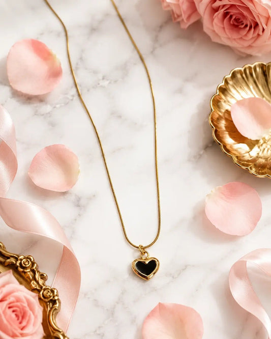 Flat lay of Black Heart Necklace - CharmsCrafted