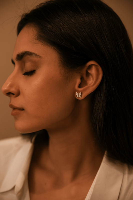 Woman wearing Butterfly stud earrings - CharmsCrafted