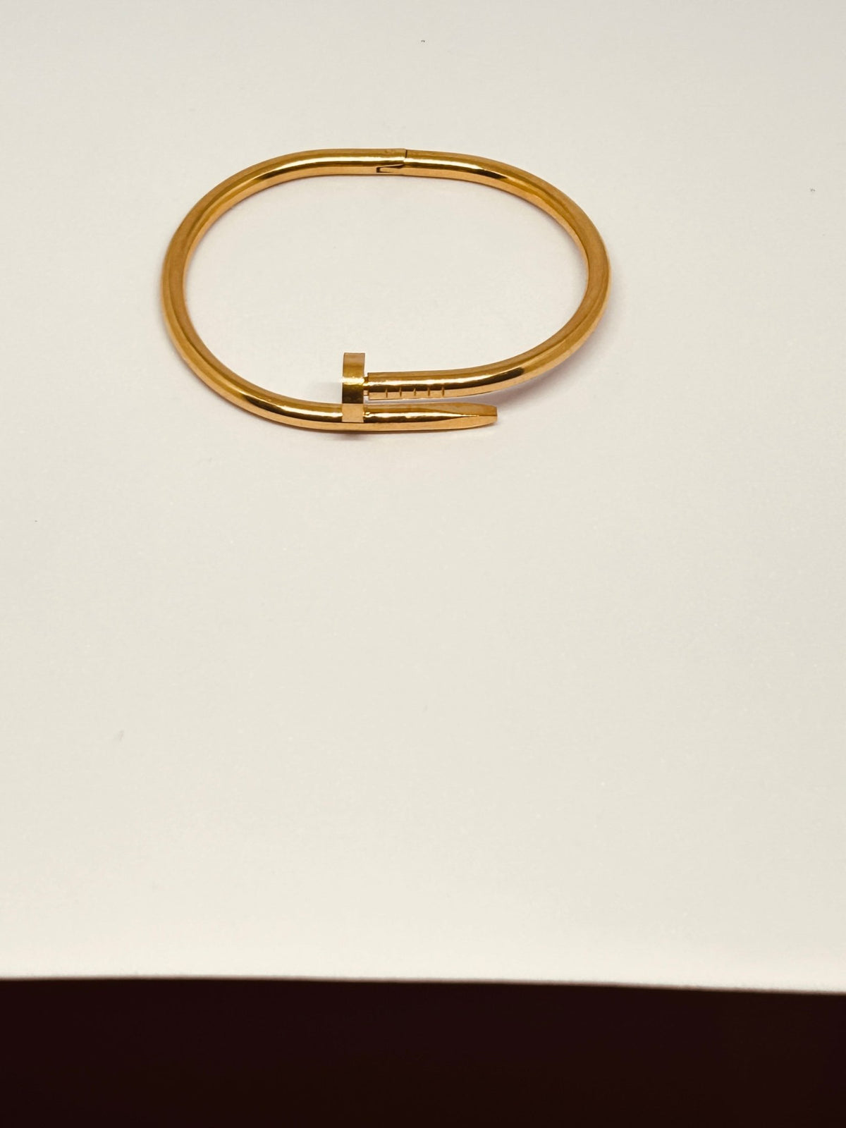 Flat lay of Cartier Nail Bracelet - CharmsCrafted