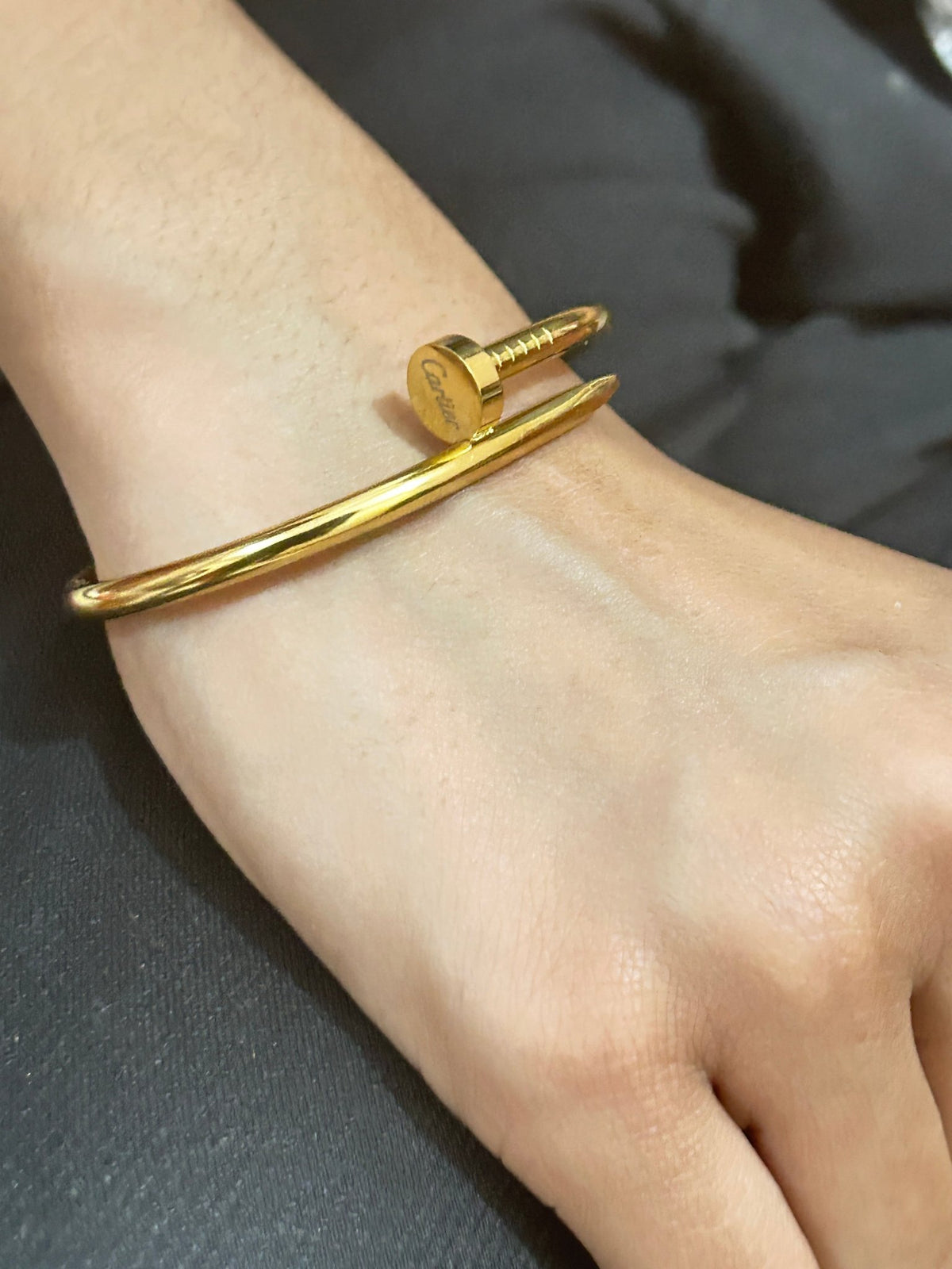 Woman wearing Cartier Nail Bracelet - CharmsCrafted