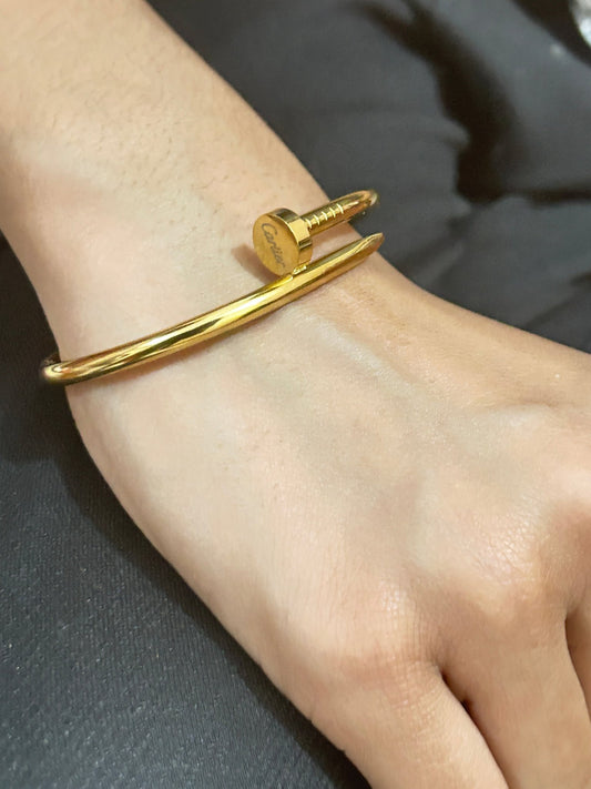 Woman wearing Cartier Nail Bracelet - CharmsCrafted