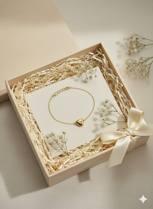 Flat lay of Dainty Heart Charm Bracelet - CharmsCrafted