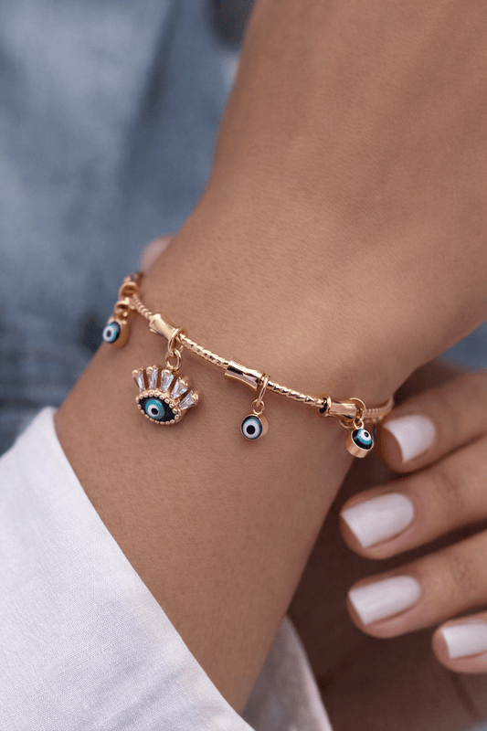 Woman wearing Evil Eye multiple charms bracelet - CharmsCrafted