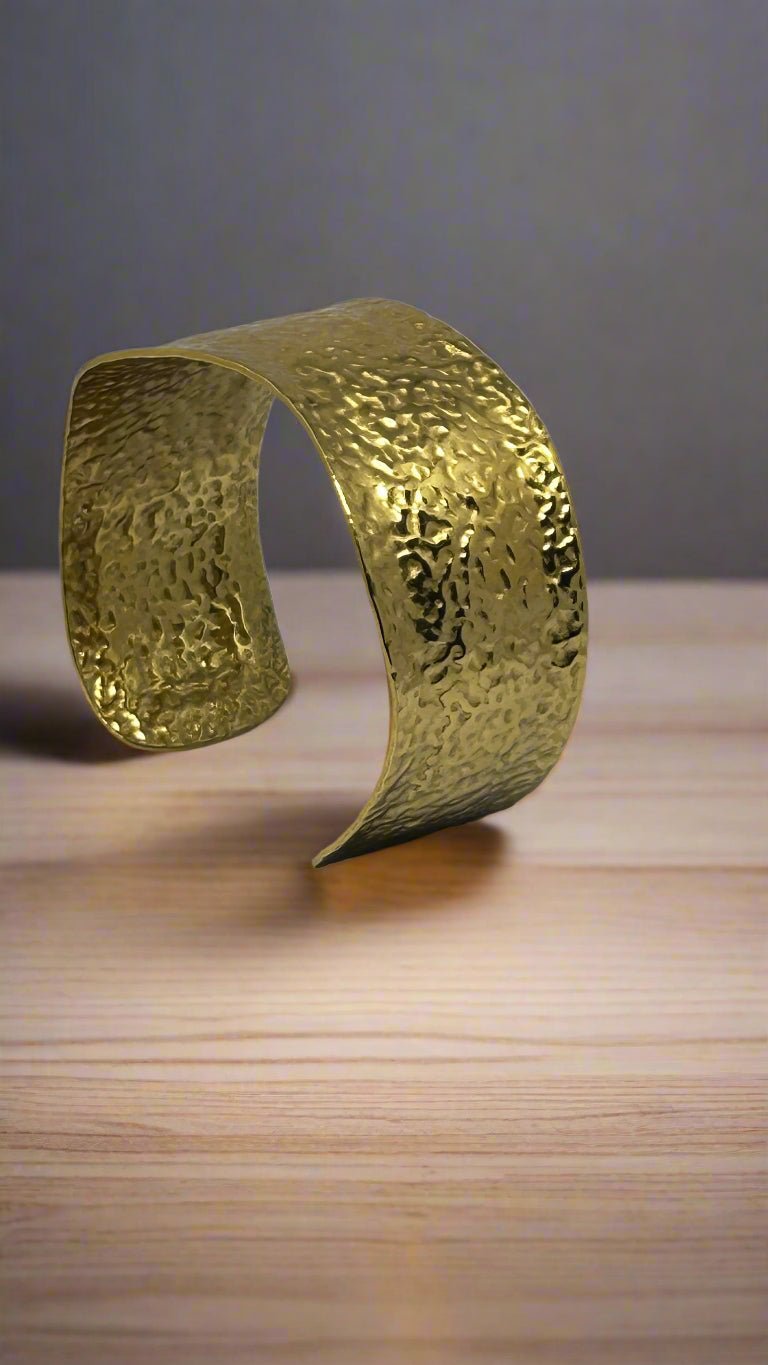 Flat lay of Golden Hammered Cuff Bracelet - CharmsCrafted
