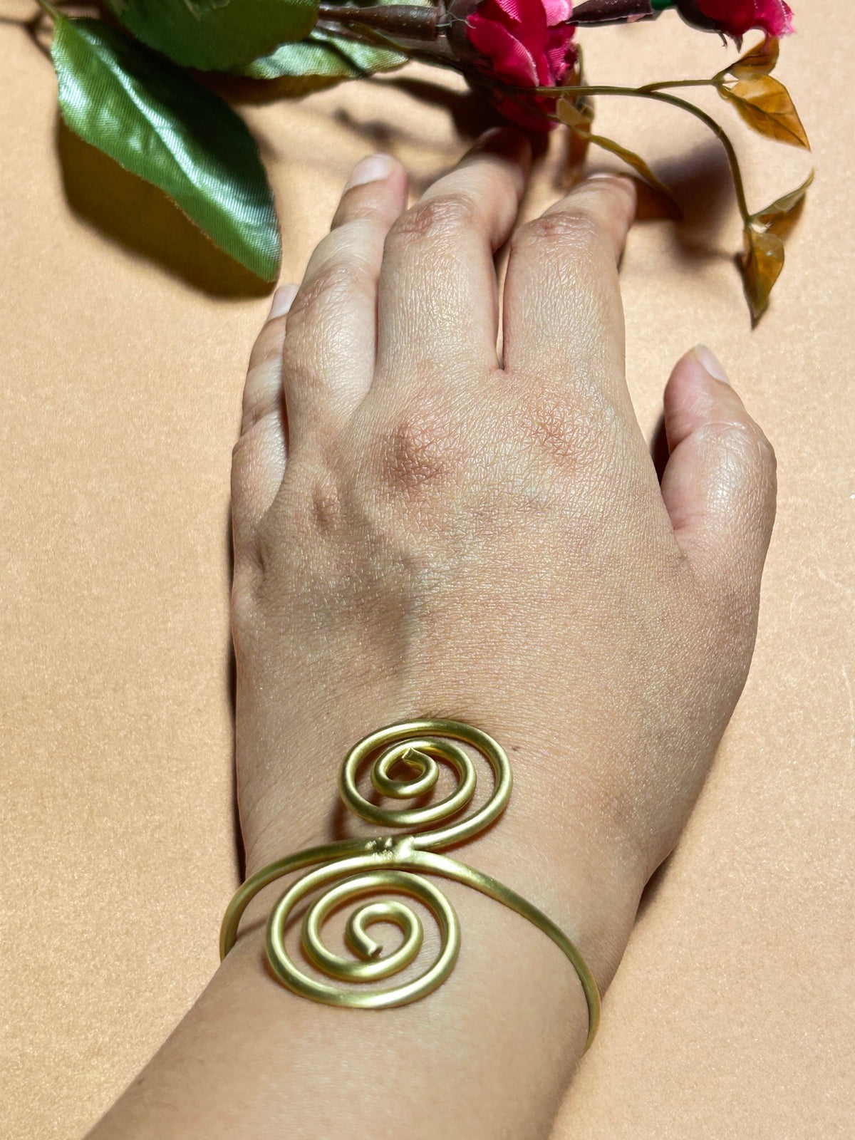 Woman wearing Handcrafted Spiral Swirl Brass Bracelet - CharmsCrafted