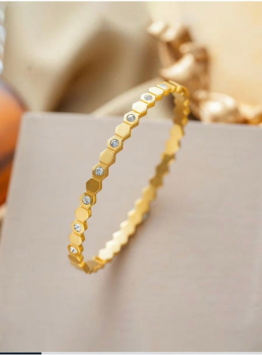 Flat lay of Thin wrist hexagonal bracelet - CharmsCrafted